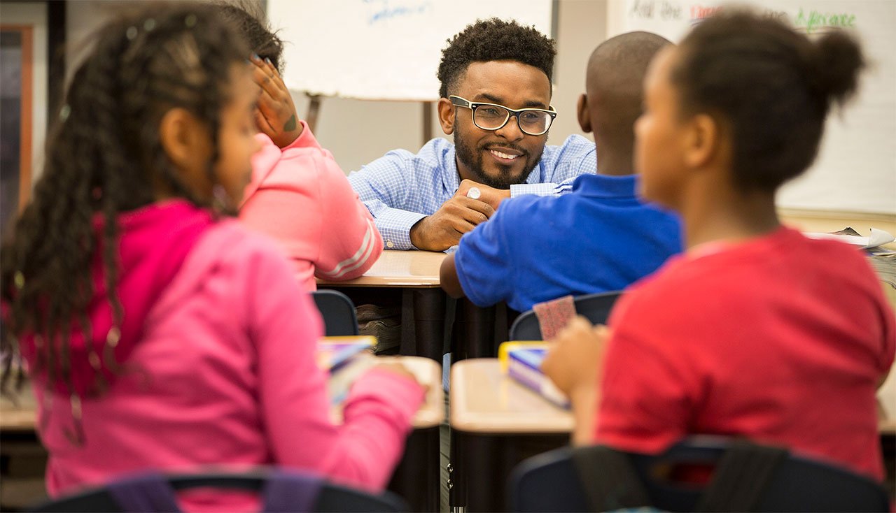 a teacher with his students